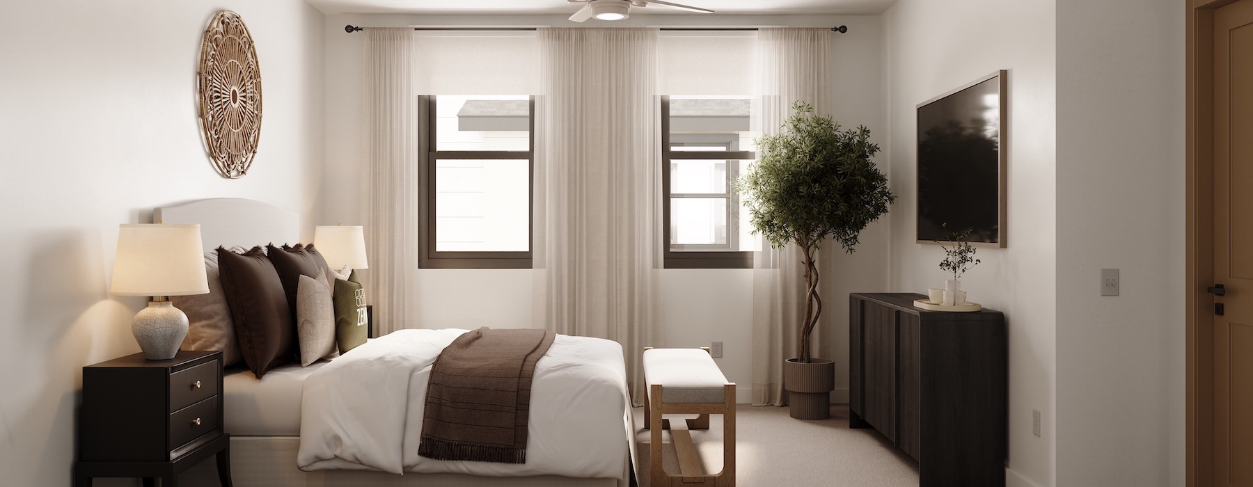 a bedroom with a bed and a fan