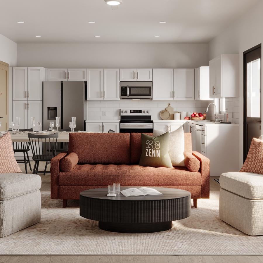 a living room with a couch chairs and a coffee table