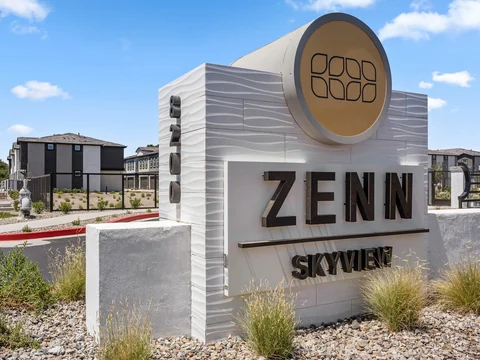 Zenn Skyview entry sign surrounded by desert landscaping