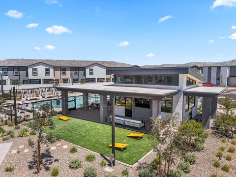 Elevated view of the clubhouse, game lawn, and surrounding townhomes