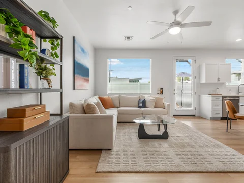 Furnished living room with a sectional sofa and glass coffee table