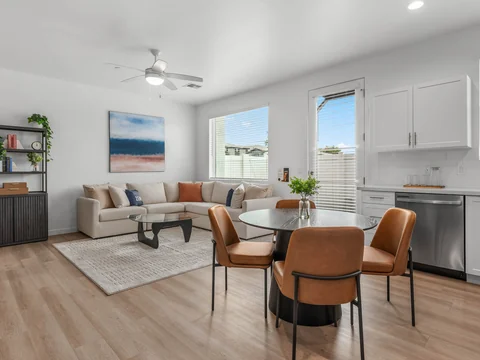 Wood-style flooring throughout an open living and dining area