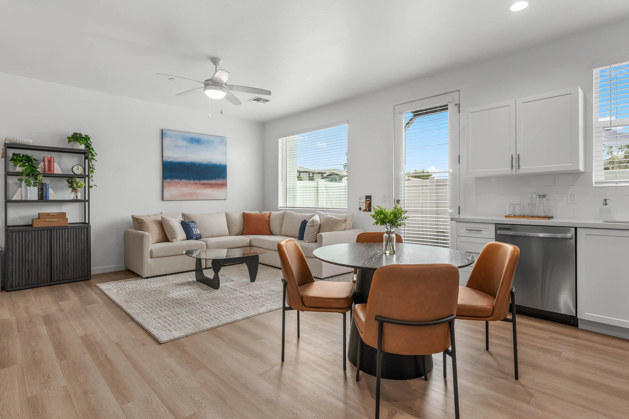 Furnished apartment living area shown — representative home at Zenn Skyview.